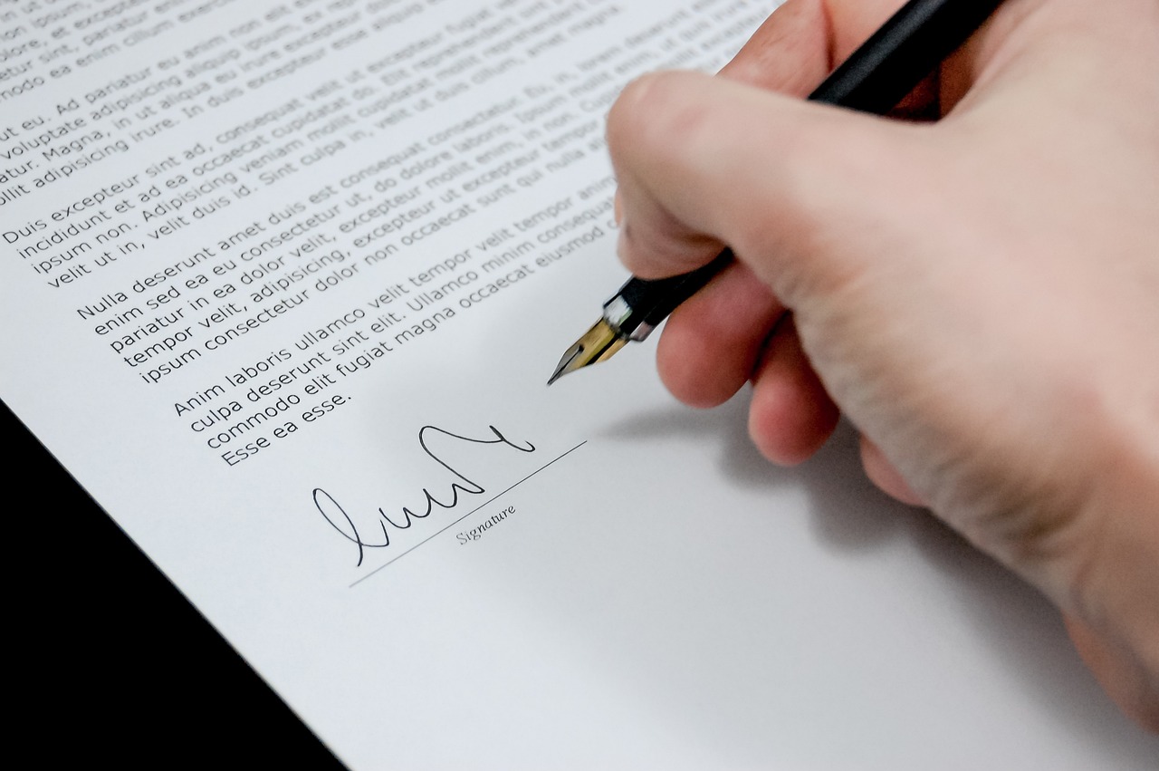 signing a document on the dotted line