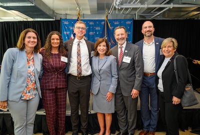 FA President Dante Morelli shown posing with state labor leaders and Governor Hochul