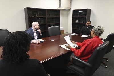 Dante Morelli listening at table during Higher Ed Advocacy Day in Albany, 2024